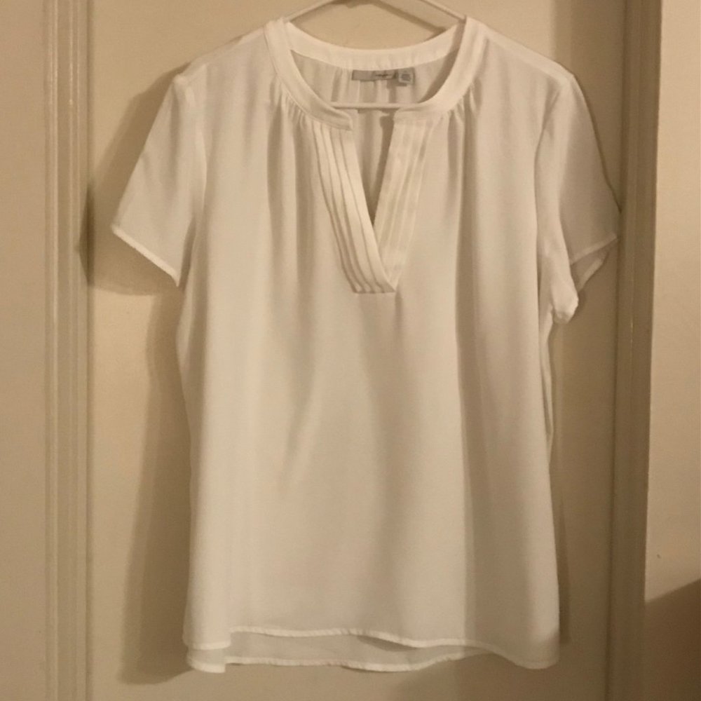 White blouse with pleated notch neckline